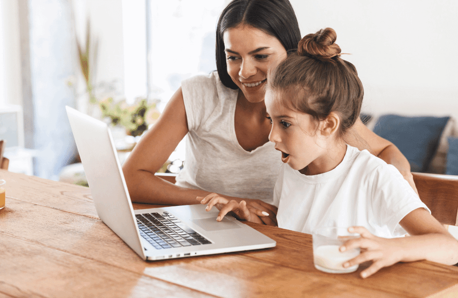 Parent and child working at a laptop