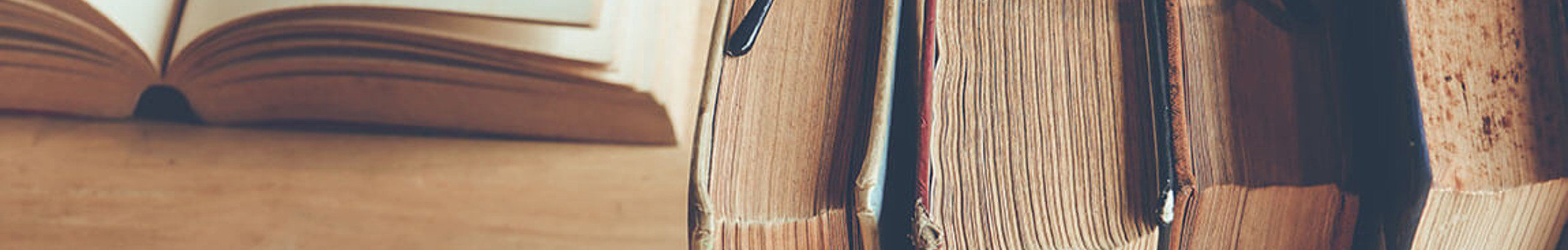 Books and reading glasses laid on a table