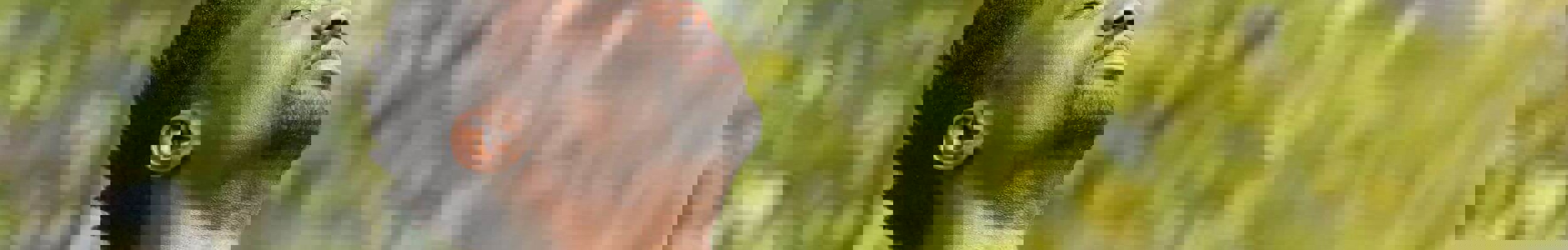 Man looking up to sky with eyes closed