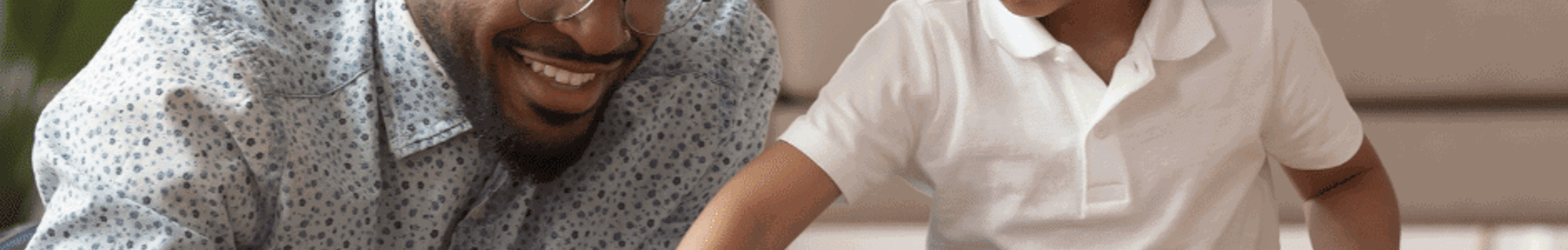 Father and son playing with toy blocks