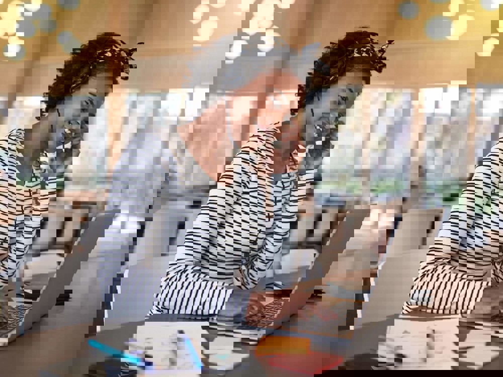 Woman smiling on laptop