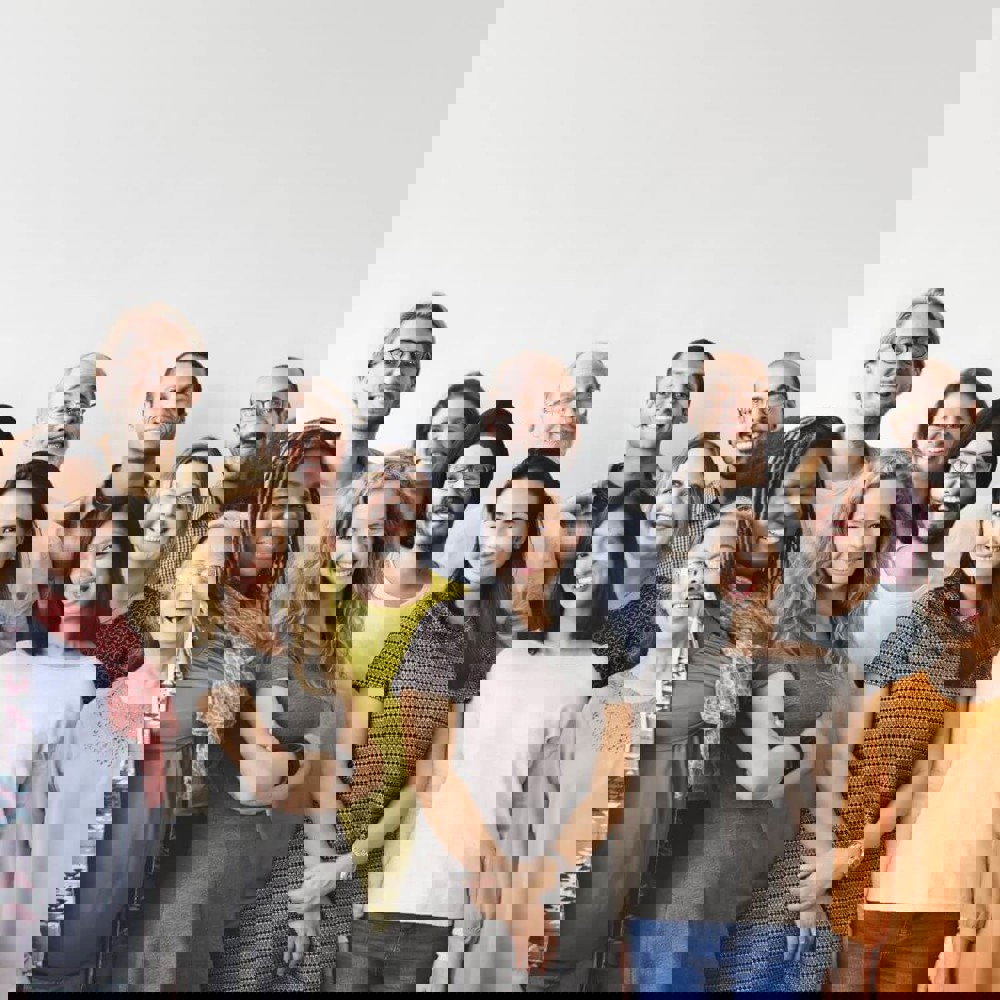 Group of people standing together smiling