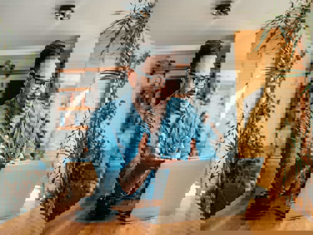 Man talking on laptop