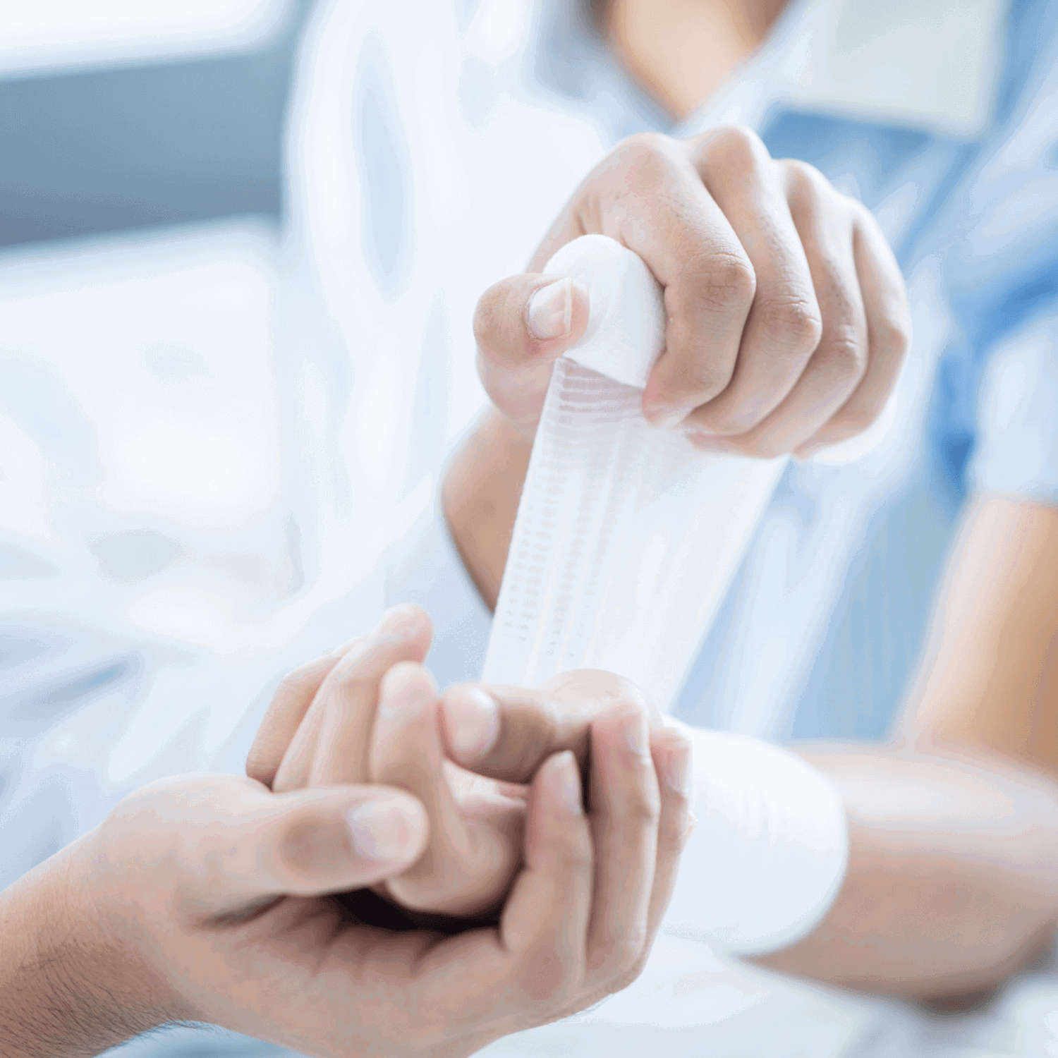 A hand being bandaged up