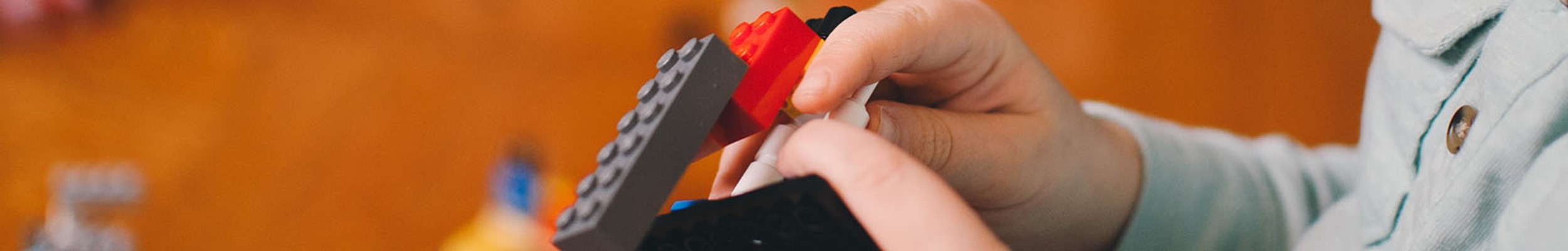Child building lego spaceship