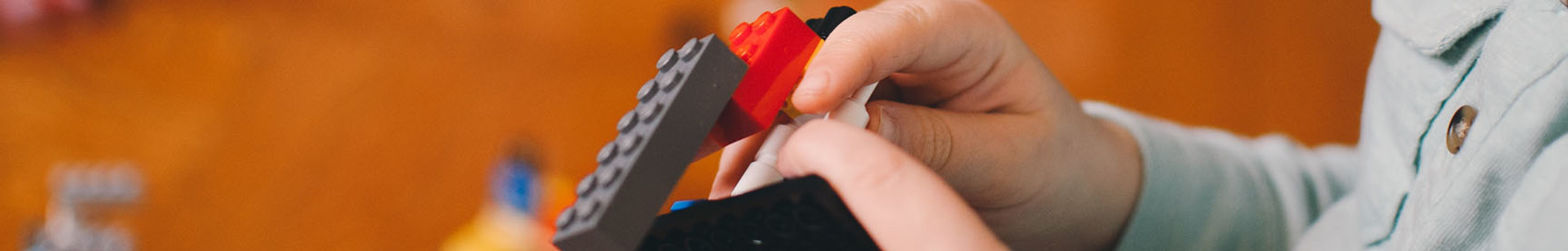 Child building lego spaceship