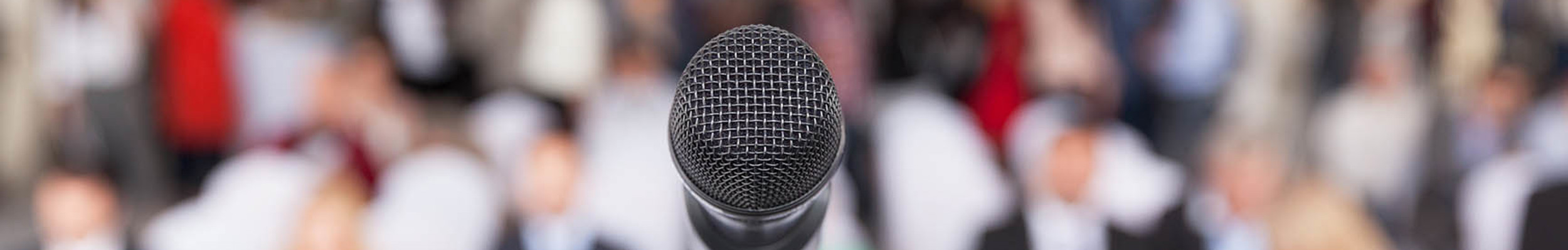 A microphone in front of an audience