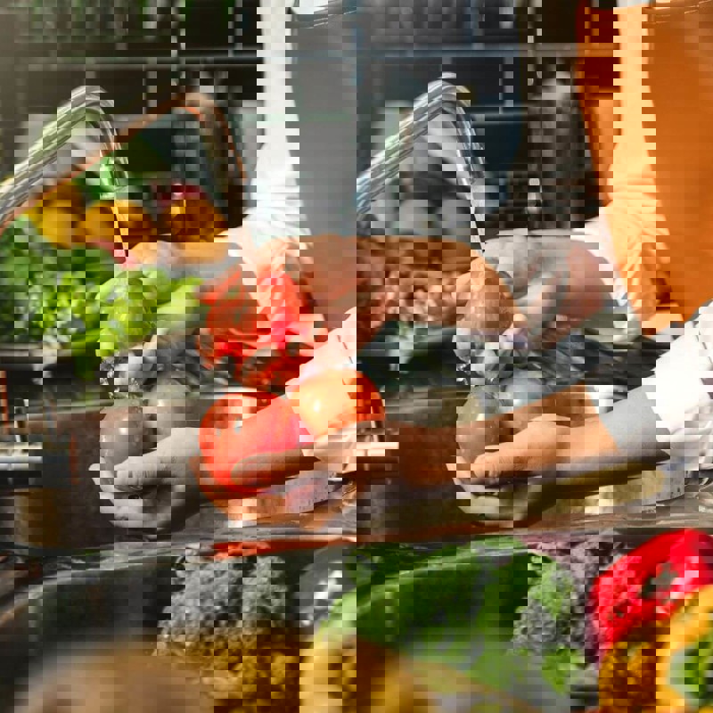 Person washing vegetables