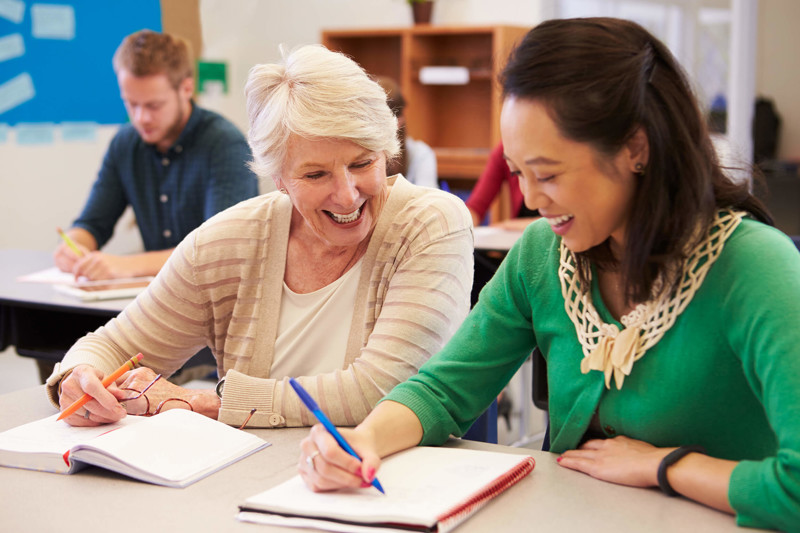 Two women in a creative writing course
