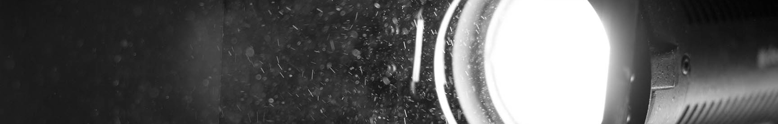 A camera filming in black and white