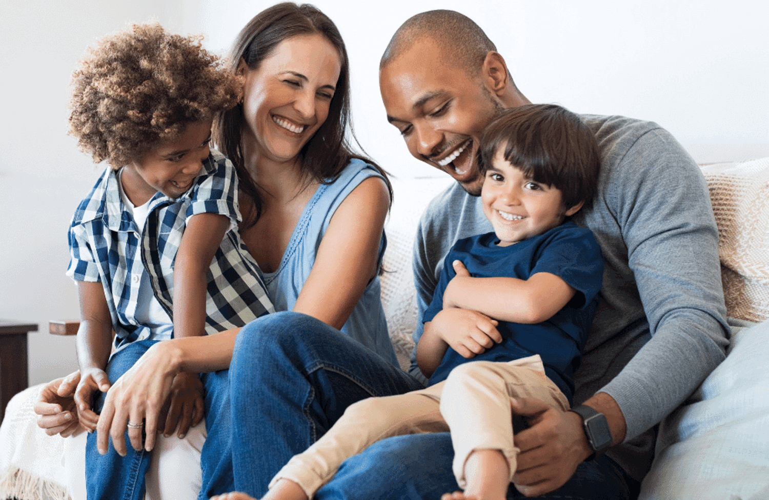 Mum and dad with sons on lap