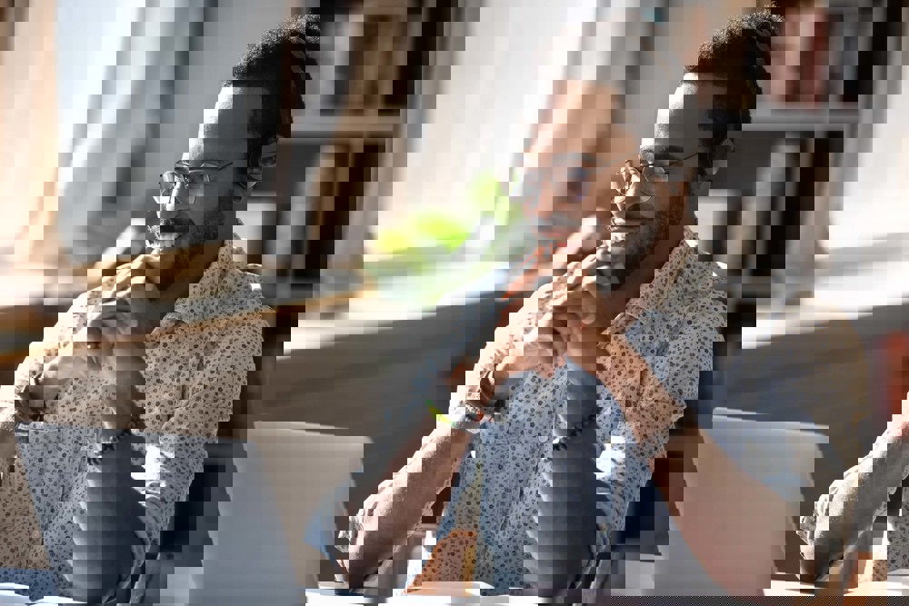 Man smiling at laptop