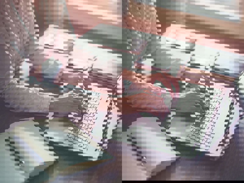 Woman typing on laptop