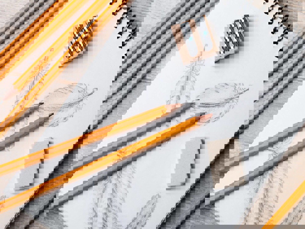 Pencils on top of sketchbook