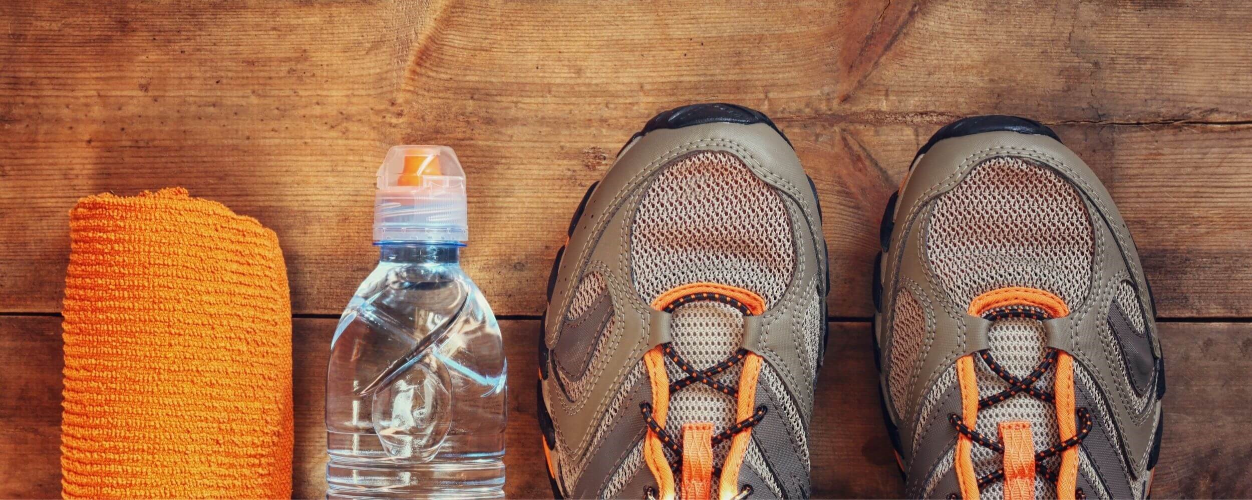 Fitness mat, water bottle and trainers
