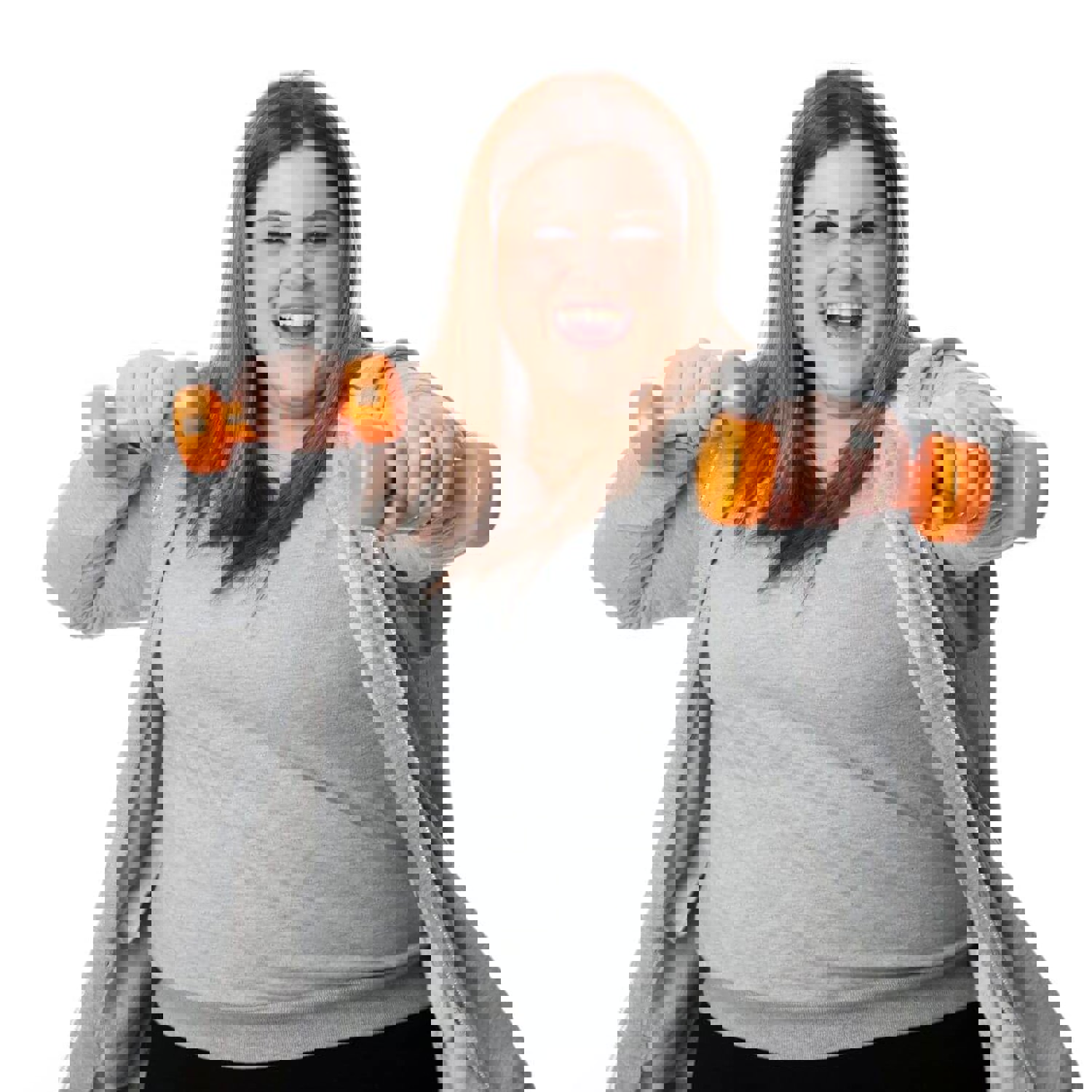 Smiling woman using dumbbells