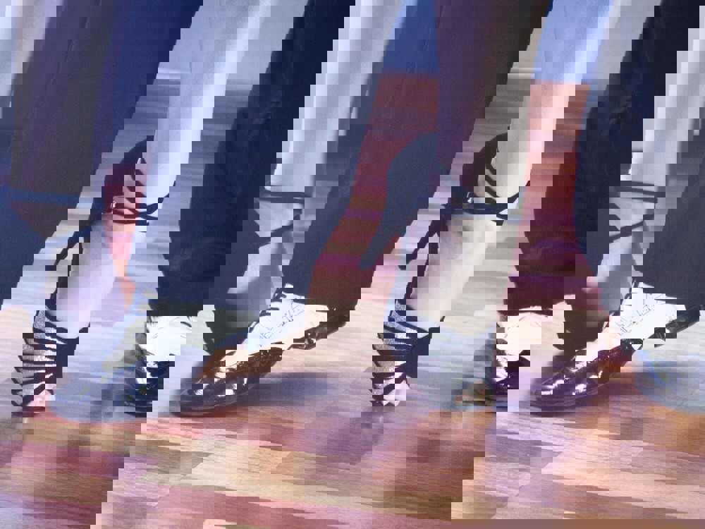 Lady teaching class in her dance shoes