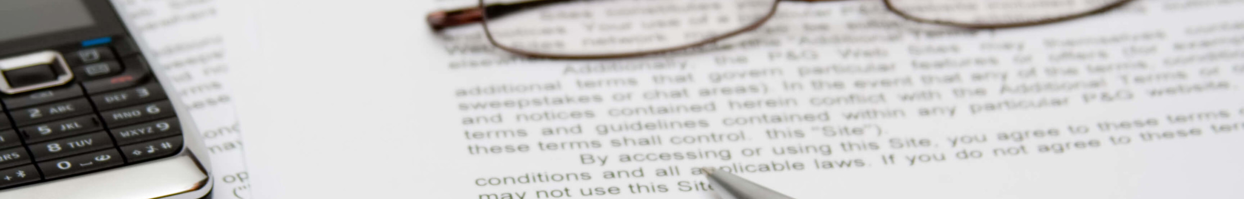 Glasses and a pen on documents